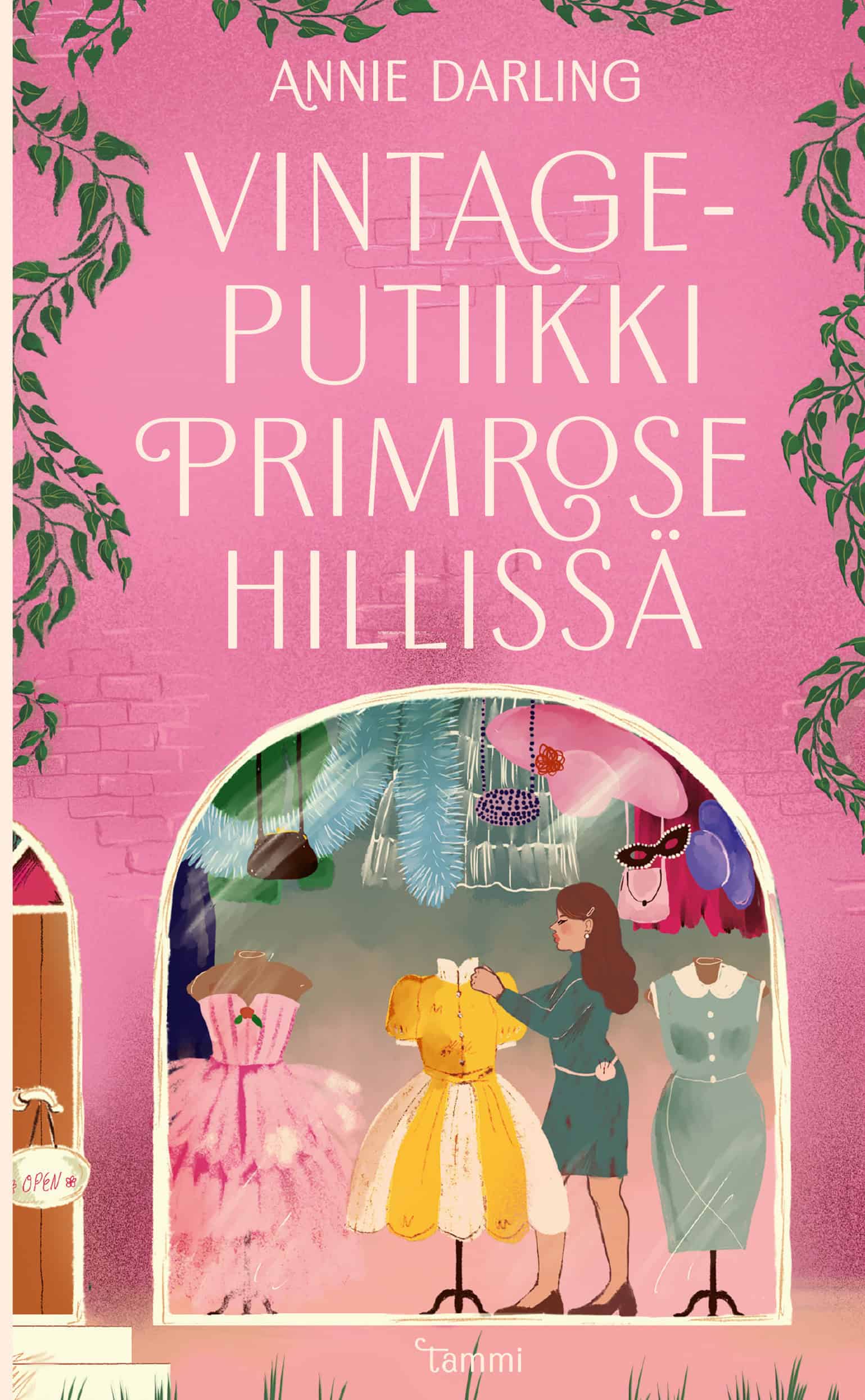 Vintageputiikki Primrose Hillissä -kirjan kannessa on piirroskuva putiikista, jossa nainen asettelee vintagemekkoja esille.