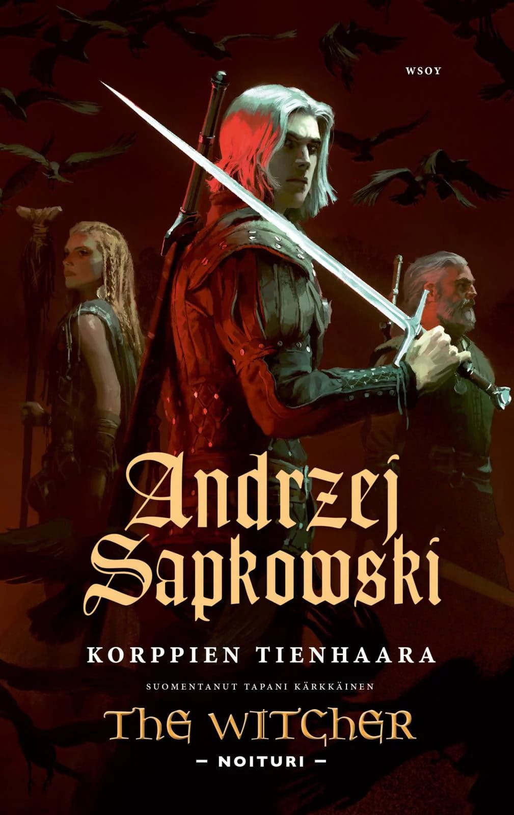 Korppien tienhaara -kirjan kannessa on noituri Geralt, valkeahiuksinen nuoren näköinen miekkamies. Taustalla on korppeja, pitkää sauvaa pitelevä nainen ja vanhempi noituri.