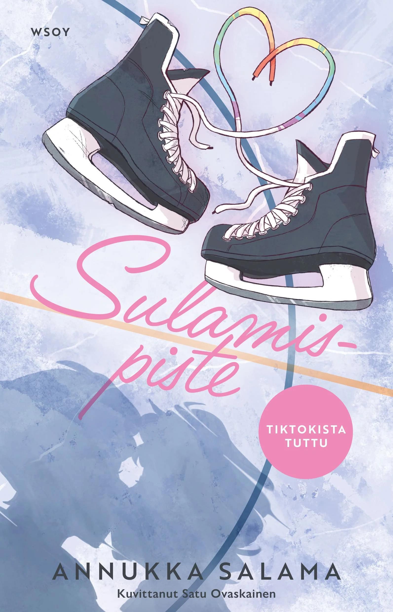 Sulamispisteen kannessa on kaksi luistinta, joiden sateenkaariväriset nauhat muodostavat sydämen. Taustalla on jään pintaa, johon piirtyy kahden suutelevan ihmisen päiden varjo.