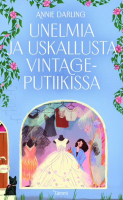 Unelmia ja uskallusta vintageputiikissa -kirjan kannessa on piirros naisesta somistamassa vintagemekkokaupan näyteikkunaa, jossa on iso valkoinen mekko.