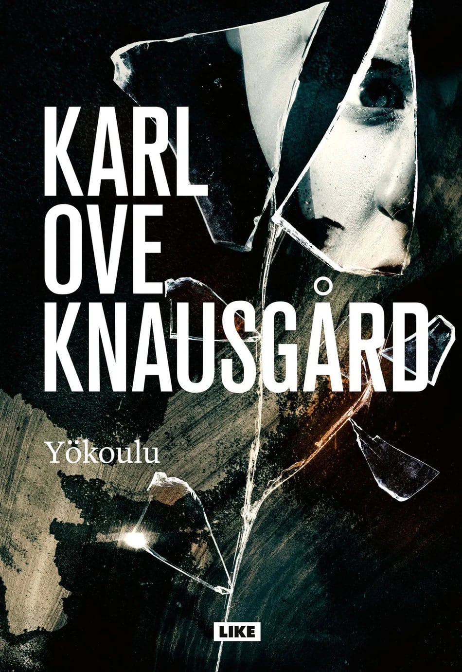 Yökoulun kannessa on kuvattuna lasinsirpaleita, joista heijastuu ihmisen kasvot.