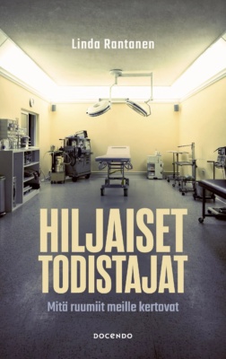Hiljaiset todistajat -kirjan kannessa on harmaan ja keltaisen sävyinen valokuva ruumiinavaussalista.