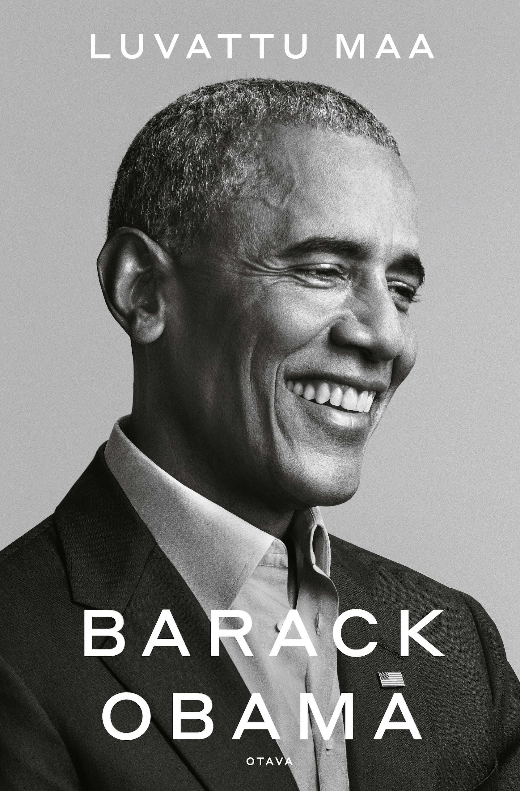 Luvatun maan kannessa on mustavalkoinen valokuva hymyilevästä Barack Obamasta.