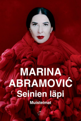 Seinien läpi -kirjan kannessa on valokuva Marina Abramovićisista punaisessa asussa.