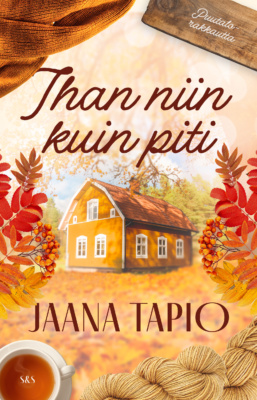 Ihan niin kuin piti -kirjan kannessa on syksyinen keltainen puutalo, jonka ympärillä on teekuppi, lankoja ja punaisia pihlajanlehtiä ja -marjoja.