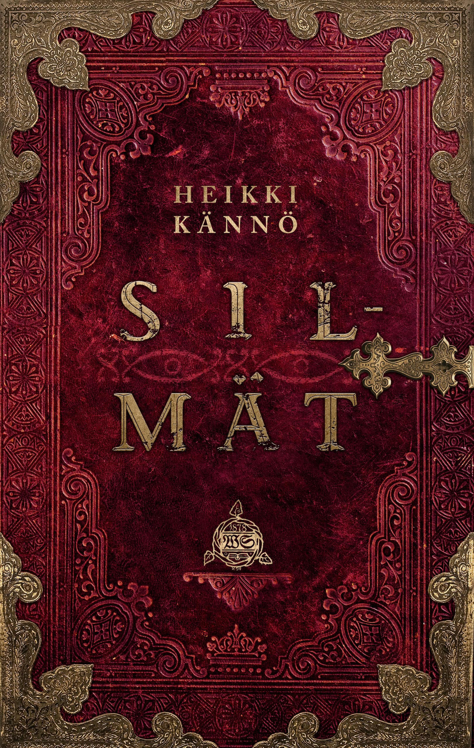 Silmät-kirjan kansi on punainen, vanhanaikaisen kirjan kansi, jossa on kultaiset koristelut ja kultainen lukitus. Keskellä näkyy haaleasti silmät.